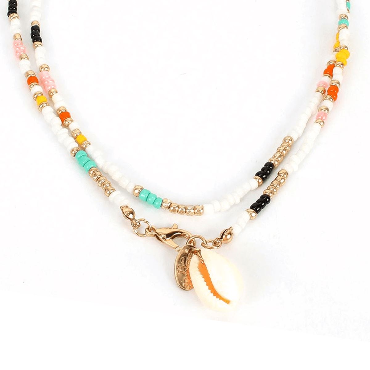 "Collier Heishi Coquillage" translates to "Heishi Shell Necklace" in English.